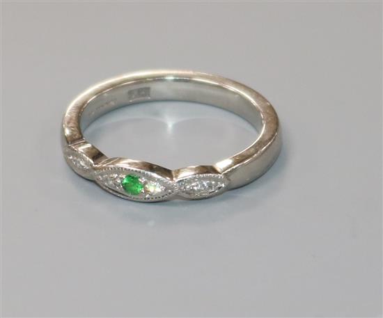 A modern platinum, green sapphire? and diamond ring, size K.